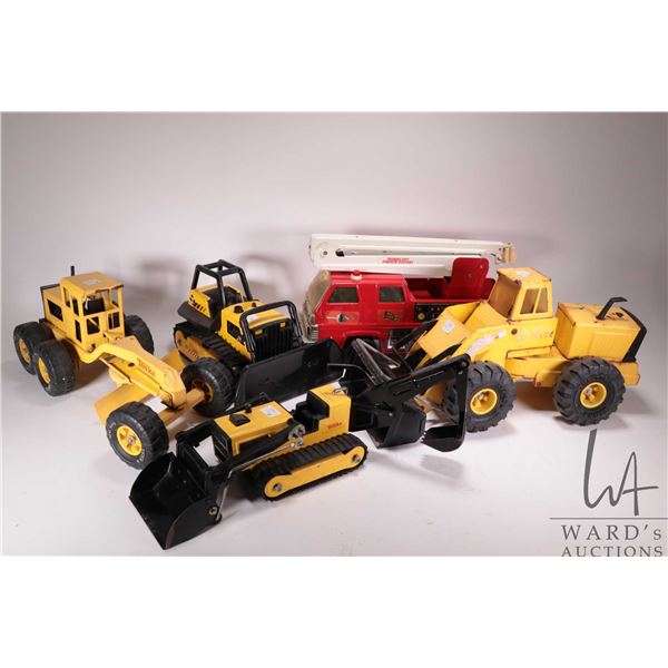5 Vintage pressed tin Tonka Toys including front end loader, grader, dozer, backhoe, and fire truck