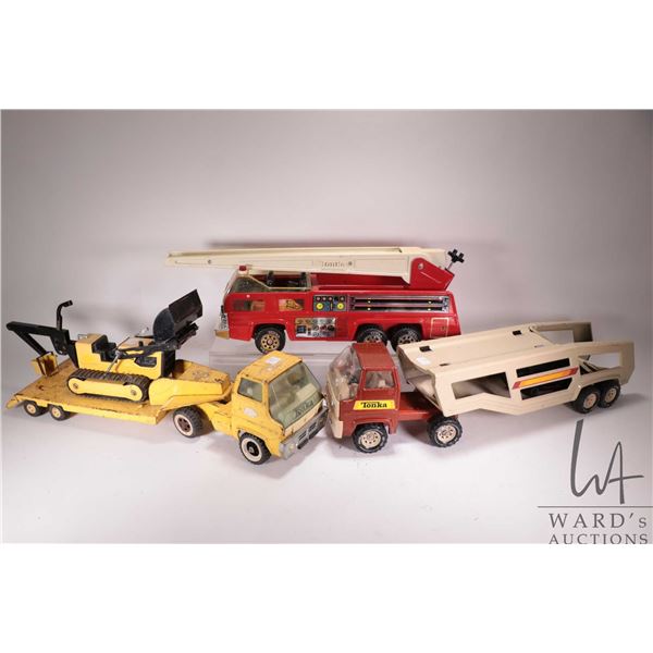 4 Vintage pressed tin Tonka Toys including fire engine (missing ladder), car carrier tractor trailer
