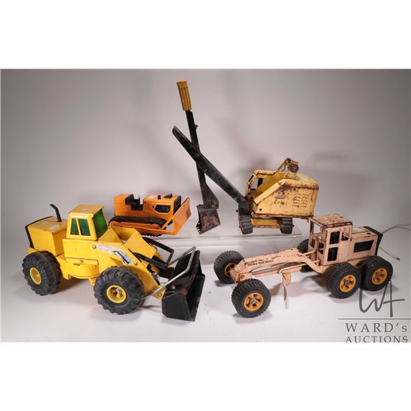 4 VIntage pressed tin Tonka Toys including front end loader, excavator, grader, and a T6 dozer