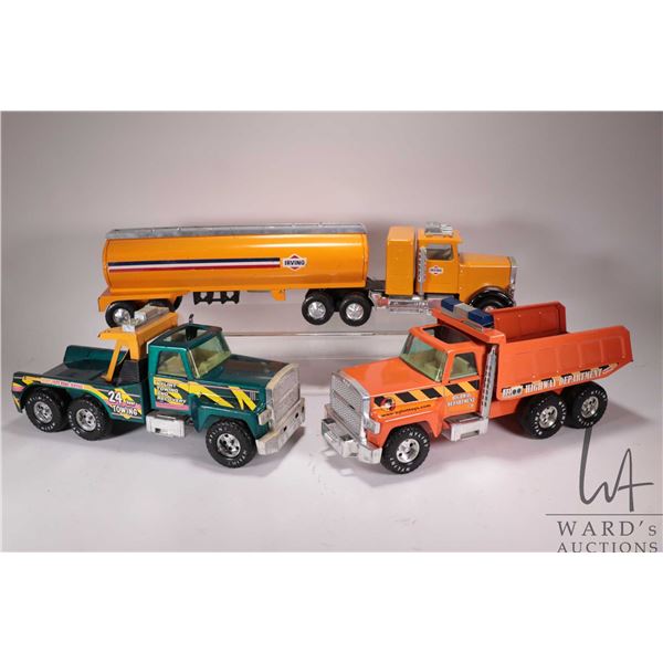 3 pressed tin Nylint Toys including tanker tractor trailer, dump truck, and toy truck, note not comp