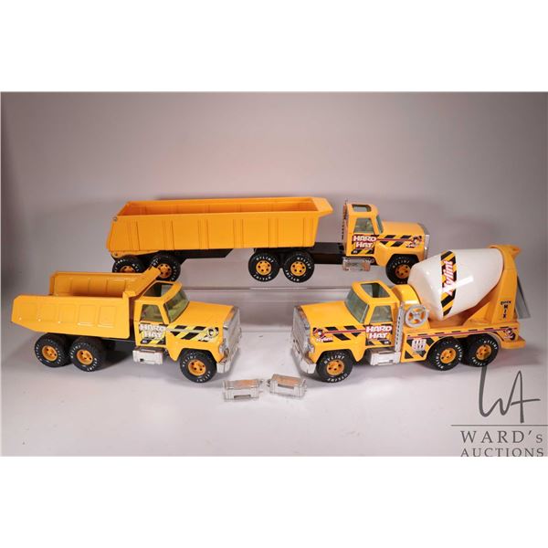 3 pressed tin Nylint hard hat construction trucks including tractor trailer dump truck, cement mixer
