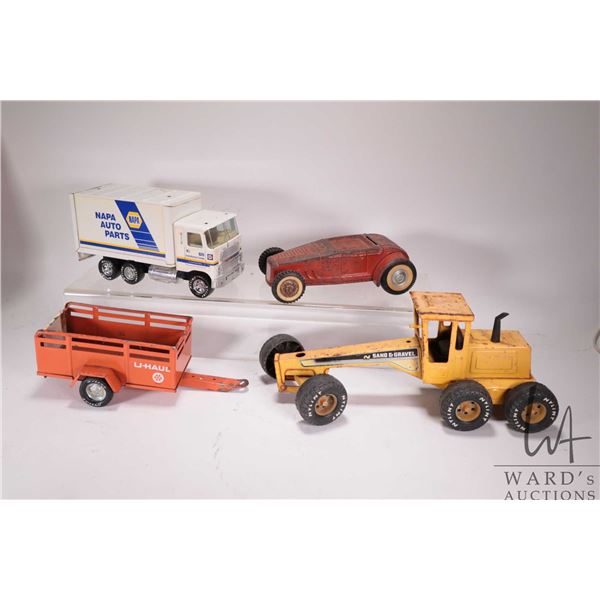 Selection of vintage Nylint toys including Roadster (missing top), U-Haul Trailer, grader (missing b