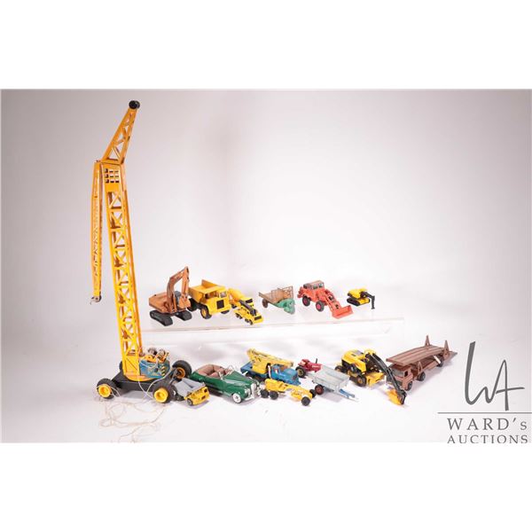 Selection of die cast toys including Playart car carrier, Matchbox front end loader, ERTL excavator,