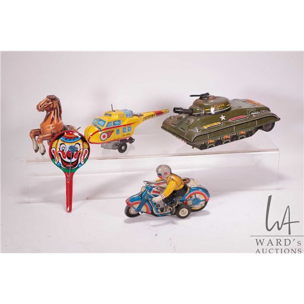 Selection of vintage tin toys, all in need of repair, including Sikorsky helicopter, wind up motorcy