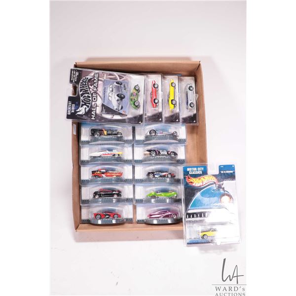 15 collectible Hot Wheels toy cars including 10 Hot Wheels Originals, 4 Hot Wheels Hall of Fame, and
