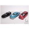 Image 1 : 3 1/24 scale die cast model cars including a 1948 Tucker, a 2005 Dodge Magnum RT Custom, and 1999 Po