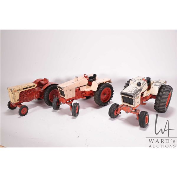 3 vintage 1/18th scale ERTL Case tractors including 1370, 1070, and a 930. Note, parts missing