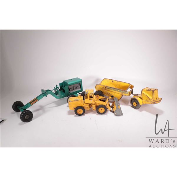 3 vintage toys including a Strutco grader, note missing blade mechanism, a Lumar Rocker-Dump, and a 