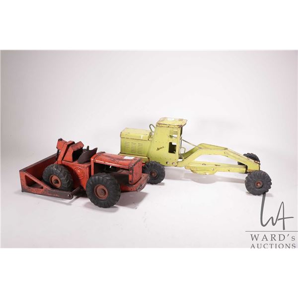 2 vintage pressed tin toys including a Lincoln Grader, missing blade, and a Ny-lint dozer