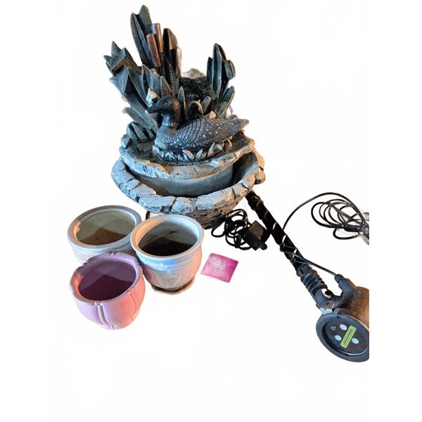 Planters With Decorative Loon Fountain And Outdoor Laser Light