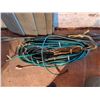 Image 6 : Utility Tires, Metal Grates, and Garden Hoses