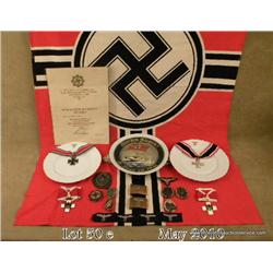 Very large reproduction lot of WWII German flags,  belt buckles, badges, insignia, and other  miscel