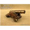 Small model of a brass deck cannon on wood  carriage with brass wheels in overall very good  conditi