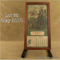 Framed color Winchester advertising calendar,  approx. 19” x 9” showing frontier couple with  their 