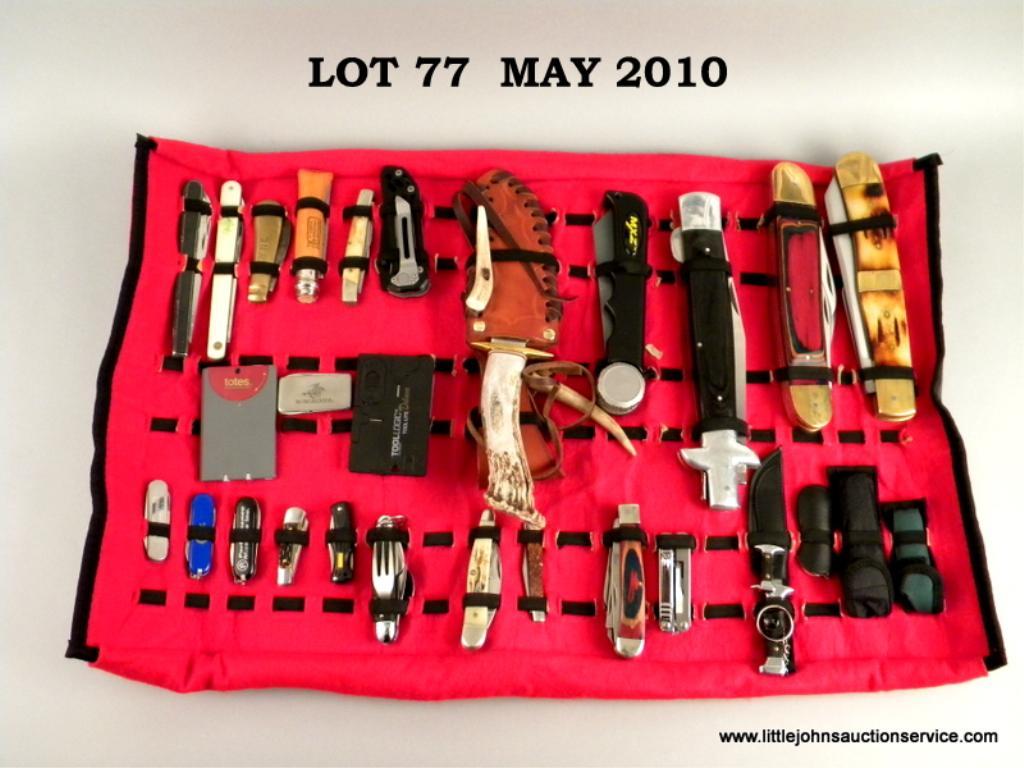 28 piece knife collection in a custom knife carry and display case