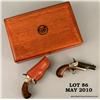 Image 4 : Pair of COLT derringers in presentation case, #  82038D and 82039D, .22 Short, enameled barrels  wit
