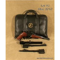 Thompson Center Arms Contender single shot pistol  with two extra barrel assemblies; gun is in .22LR