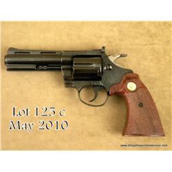 Colt Diamondback DA revolver, .22LR cal., 4”  barrel, blue finish, checkered combat wood  medallion 