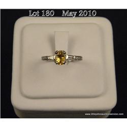Beautiful 14 karat white gold ladies custom made  ring set with a center fine yellow sapphire  weigh