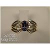 Image 2 : Stylish 14 karat yellow gold ladies ring set with  a center oval Tanzanite weighing approx. 1.00  ca