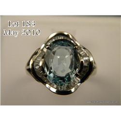 Dazzling 14 karat white gold ladies ballerina  design ring set with a center blue Aquamarine  weighi