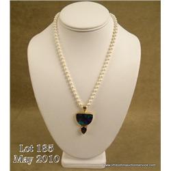 One of a kind custom made ladies 18 and 14 karat  yellow gold combination pendant bezel set with a  