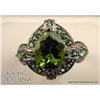 Image 1 : Marvelous 14 karat white gold ladies custom made  ring set with a center fine green Peridot weighing