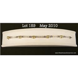 Dazzling 14 karat two-tone gold ladies designer  bracelet bezel set with 10 oval cut Tanzanite  weig