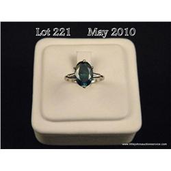 Brilliant 14 karat ladies Platinum ring set with a  large center oval cut diamond weighing 3.34  car