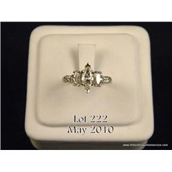 Important 14 karat white gold ladies ring set with  a center very fine MQ cut diamond weighing 0.78 