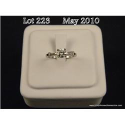 Vintage 14 karat white gold ladies ring set with a  center fine round brilliant cut diamond weighing