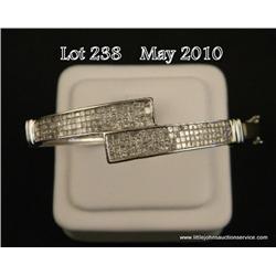 A one of a kind 14 karat white gold ladies custom  made bangle bracelet invisible set with over 200 