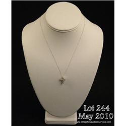 One diamond cross set with approx.  0.75ct. of  diamonds in 14kt white gold with chain. Est.  $1,200