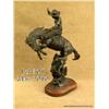 Image 1 : Original bronze of Cowboy on bucking bronco.  Cowboy wearing wooly chaps, Colt single action in  a h