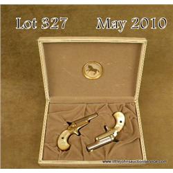 Cased pair of Colt Lady single shot derringers,  .22 short cal., 2-1/2” barrels, gold finish, faux  