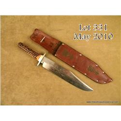 Large clip point bowie knife marked “I*XL” with  leather scabbard marked “I*XL, Sheffield, Eng”.  Th