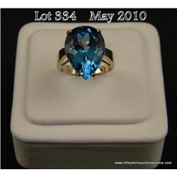 Superb10 karat yellow gold ladies ring set with a  large pear shape sky blue topaz weighing approx. 