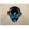 Image 2 : Superb10 karat yellow gold ladies ring set with a  large pear shape sky blue topaz weighing approx. 
