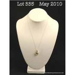 Nice 10 karat white gold ladies pendant set with a  center green Amethyst weighing approx. 7.00  car