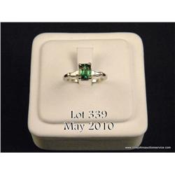 High quality 14 karat white gold ladies ring set  with a center fine green Tsavorite garnet weighing