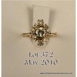 Ladies 14kt yellow gold ring, 0.30 carat center  with approx. 0.25 carat on the side. $200-$400.