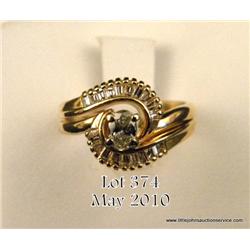 Ladies 14kt yellow gold wedding set, center .33  carat oval with side baguette cut diamonds.  $250-$