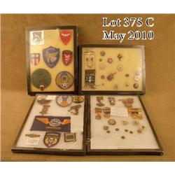 Lot of four riker mounts of various US military  insignia including marksmanship medals, squadron  p