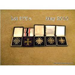 Lot of WWII German cased War Merit crosses in very  good plus condition. Est: $250 - $500