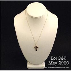 One 14kt yellow gold cross set with 6 oval garnets  weighing 3.60ct. Est. $175-$300.