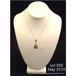One pendant set with a round blue zircon approx  3ct in 10K yellow gold,  with a chain. Est.  $400-$