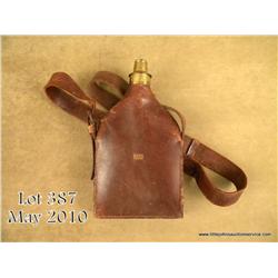 Rare C. & J. W. Hawksley leather shoulder flask  with brass charger that retaining a small metal  pa