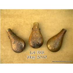 Lot of three large brass Peace flasks including  one with the “US” shield and stand-of-flags,  “shak