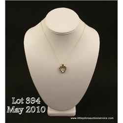 Charming 10 karat yellow gold ladies heart design  necklace set with nice fern green emeralds and  s