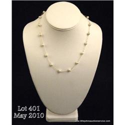 One pearl and link chain necklace. Est. $150-$200.